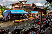 Thailand, Locals sell fruits, food and products at Damnoen Saduak floating market near Bangkok 